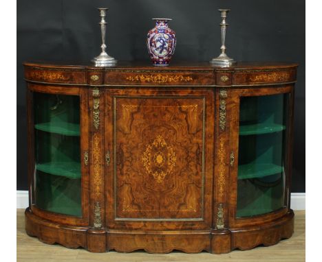 A Victorian gilt metal mounted walnut and marquetry credenza, slightly oversailing top above a central panel door flanked by 