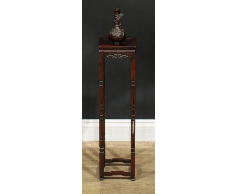 A Chinese hardwood vase stand, square panel top, shaped frieze pierced and carved with lotus, pierced supports, 66cm high, 17