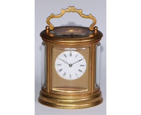 A late 19th century gilt brass oval repeater carriage clock, 5.5cm enamel dial inscribed with Roman and subsidiary Arabic num