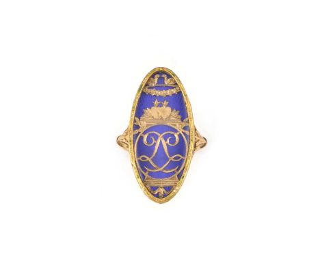 A rare cut gold and enamel ring, late 18th century, of elongated oval outline, the central glazed panel containing sheet gold