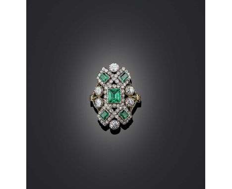 A fine emerald and diamond ring, 19th century, of saddle design, set with a geometric arrangement of step-cut emeralds and ci