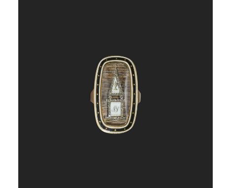 λ A diamond and ivory mourning ring, circa 1792, of oblong outline, centring on a glazed panel containing a funerary monument