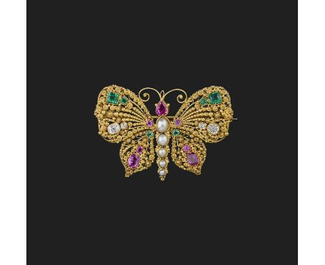 A fine ruby, emerald and diamond brooch, 1830s, designed as a butterfly in gold cannetille, set with step-cut, pear- and cush