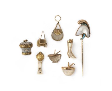 A group of seven charms and a stick pin, 19th century, comprising: five mother of pearl charms including a lute, a bag, two w