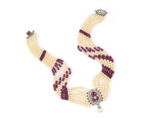 A carved ruby, pearl and diamond choker, early 20th century, centring on a spray of carved rubies and circular-cut diamonds, 