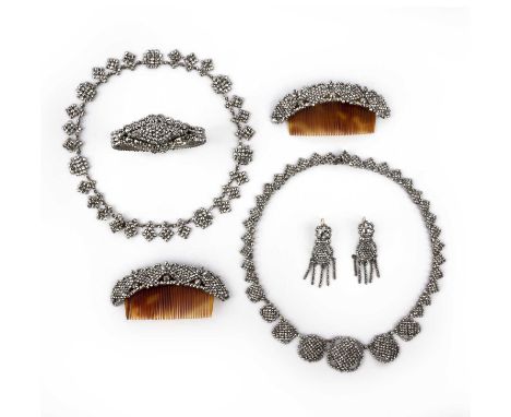 λ A suite of cut steel jewels, 19th century, comprising: a pair of hair ornaments with tortoiseshell fittings, length 9cm eac