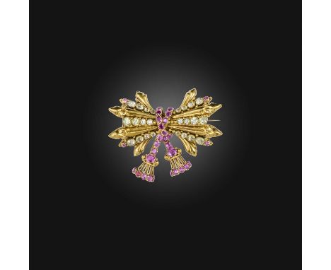 A ruby and chrysoberyl brooch, mid 19th century, designed as a trophy bound by rope, set with circular-cut rubies and chrysob