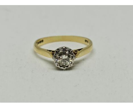 A hallmarked 18ct yellow gold diamond solitaire ring, illusion set with a round brilliant cut diamond measuring approx. 0.40c