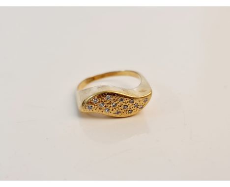 A pave set diamond cluster ring of wave design, assessed as 18ct gold, ring size M 1/2