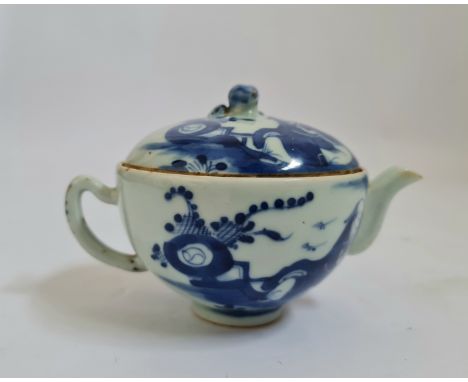 A 19th century Chinese blue and white teapot man resting design to body and lid height 10 cm.