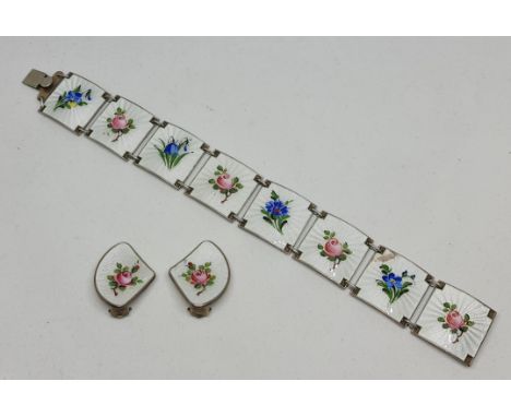 An Ivar Holth Norwegian guilloche enamel bracelet and earring set, the bracelet comprising eight white guilloche enamel panel