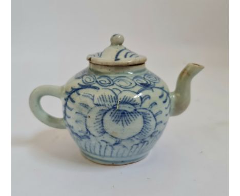 A 19th century Chinese blue and white teapot flower and leaf with spiral to rim design height 9 cm.