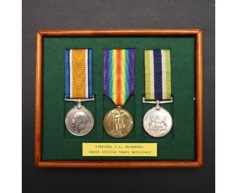 A FIRST WORLD WAR GROUP OF THREE TO THE SOUTH AFRICAN HEAVY ARTILLERY. A group of three comprising War Medal named to Cpl J.L
