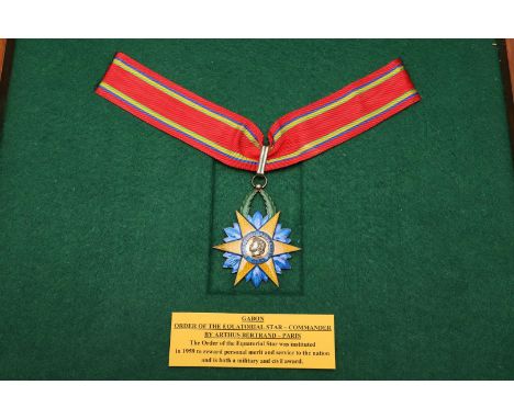 GABON ORDER OF THE EQUATORIAL STAR, COMMANDER'S NECK BADGE. A six pointed yellow enamel star against a blue ground, with fema