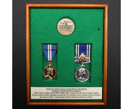 A PAIR OF MEDALS TO POLICE CONSTABLE KATHLEEN MATHIAS OF DYFED POWYS POLICE. A pair comprising Elizabeth II Golden Jubilee Me