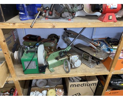 Shelf containing sander, grinder and a jigsaw