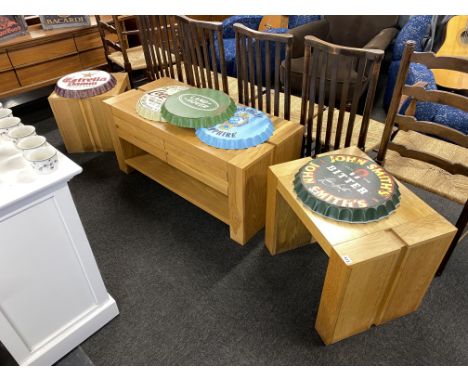 A light oak coffee table, with drawers and two occasional tables