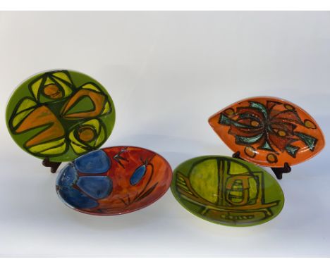 Four mid 20th Century Poole dishes, the largest with a diameter of 27cm
