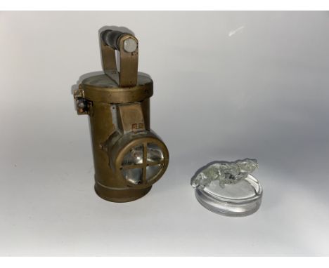 A brass cased factory inspection lamp, 24cm H and a leaded crystal Jaguar car mascot ornament