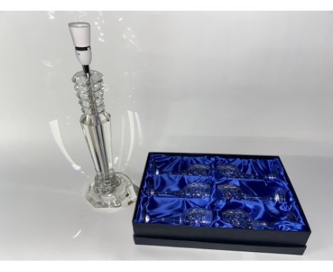 A cut glass faceted table lamp and a boxed set of six Bohemian crystal wine glasses
