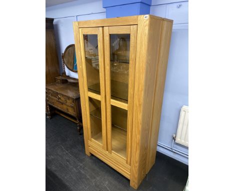 A deep light oak display cabinet, 90cm W, 50cm D, 180cm H