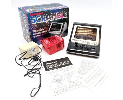 Vintage 1982 Grandstand Scramble Electronic mini arcade game in original box t/w universal mains adaptor - box slightly a/f -