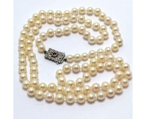 Long strand of pearls with 9ct hallmarked white gold clasp set with diamonds + centre ruby ~ strand 92cm &amp; beads approx 7