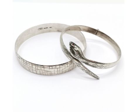 Silver hallmarked snake bangle with garnet eyes by Fred Manshaw Ltd t/w silver 7.5cm diameter bangle by MG ~ total weight (2)