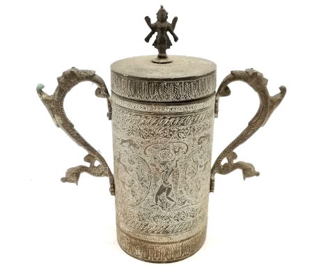 Vintage Indian brass 2 handled cylindrical vessel with lid adorned with deity finial and has animalia handles - 25cm high 
