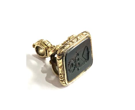 Georgian gold cased hard stone  seal fob intaglio coat of arms seal measures approx 2.6cm by 1.1cm wide in good condition wei