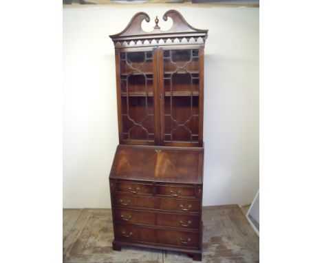 Quality mahogany reproduction bureau bookcase with two upper glazed doors above fall front with fitted interior above two sho