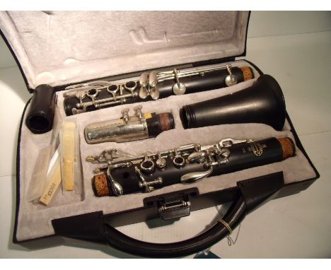 Cased Buffet Crampon & Cie of Paris B10 clarinet with associated accessories including music stand, books etc 