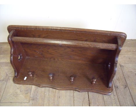 Early 29th C oak wall shelf with hanging rail and four coat hooks (80cm x 35cm)