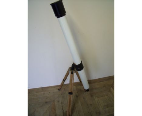 Large modern telescope on adjustable tripod stand 