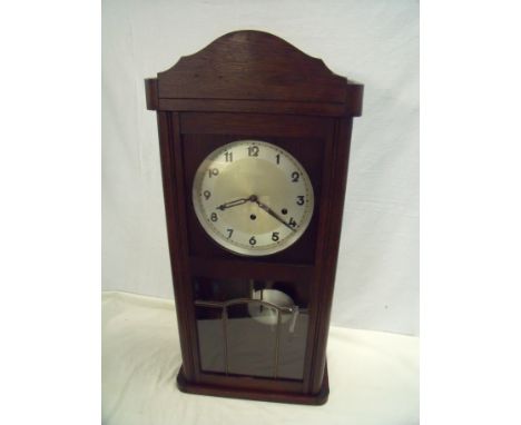 Oak cased 8 day wall clock with Westminster chime and steel face 