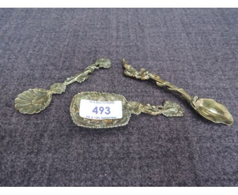 Three bronze finish white metal caddy spoons of naturalistic design