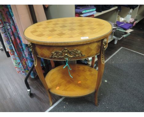 A mid 20th century light mahogany occasional table in the French style having marquetry top with ormolu style applique and sh