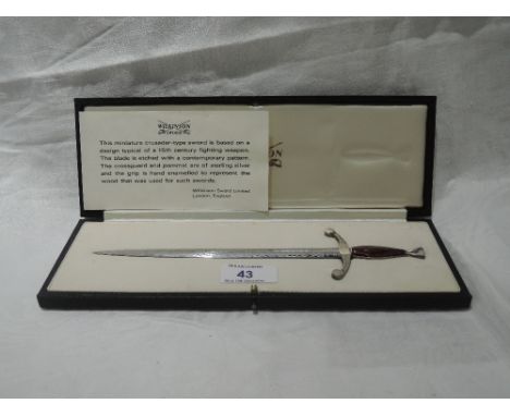 A cased letter knife by Wilkinson Sword modelled as a 15th century crusader's sword having etched decoration to blade, HM sil