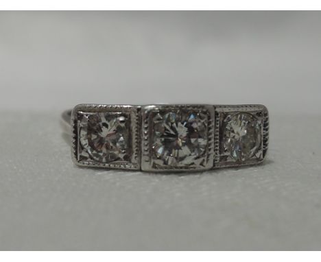 A lady's dress ring having a trilogy of diamonds, total approx 1ct in pave set square mounts on an 18ct white gold loop,  siz