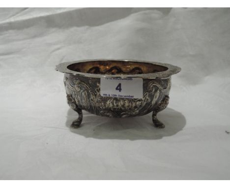 A Victorian Scottish silver bowl having wheat sheaf and scroll decoration, engraved shaped rim and trefoil hoof feet, Edinbur