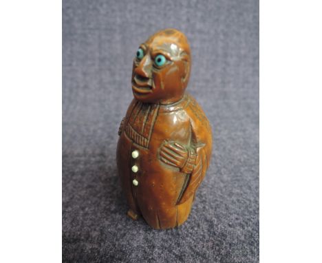 An early 19th century Continental Coquilla nut snuff box modelled as a coated gentCONDITION REPORTLeft foot broken as image s
