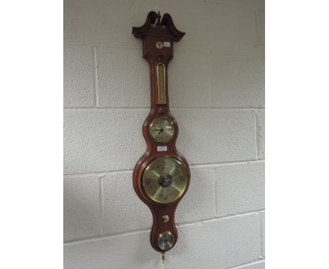 A modern mahogany banjo aneroid barometer having thermometer and hyrgometer scale and clock