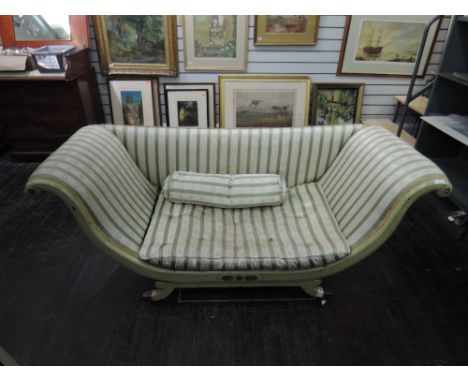 A 19th century green painted sofa in the Regency style having later Regency stripe upholstery on scroll and splay frameDimens