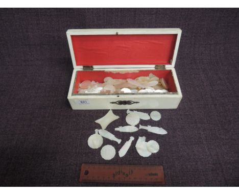 A selection of vintage mother of pearl gaming counters having incised decoration in a later box