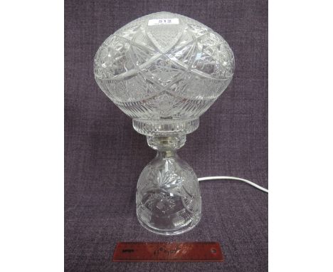 A glass table lamp of traditional mushroom style