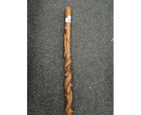 A vintage treen walking stick of ethnic snake twist design