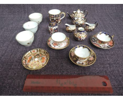 A selection of ceramic miniatures including 19th Century Derby and early 20th century Royal Crown Derby in the Imari palette