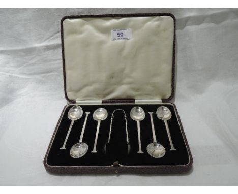 A cased set of silver teaspoons with matching sugar nips of architectural form, Chester 1929, Hirst Brothers