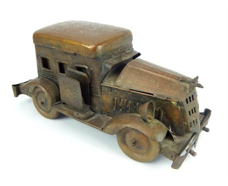 Inter war "trench art" model car, forming a desk top tidy, the bonnet & roof opening to provide storage for pens & inks, 14.5