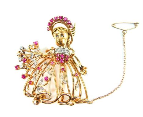 A high carat yellow gold vintage diamond and ruby brooch in the form of a rag-doll holding a bouquet of flowers, unmarked, 4.